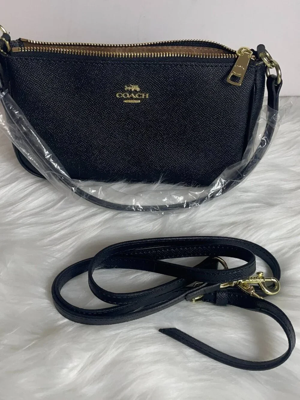 Black zipper top small shoulder bag with extra long strap